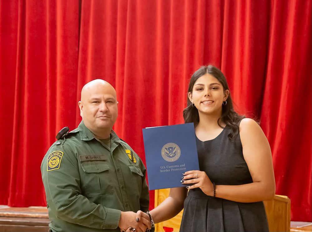 Mykla Siddiq receives a scholarship from  Border Patrol